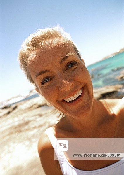 Close-up of woman at the beach.