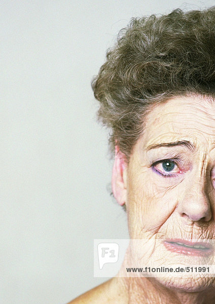 Senior woman looking at camera  partial view  close-up