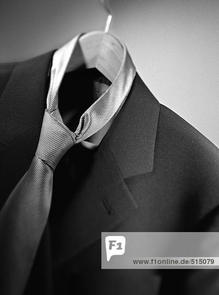 Suit jacket with tie on hanger  close-up