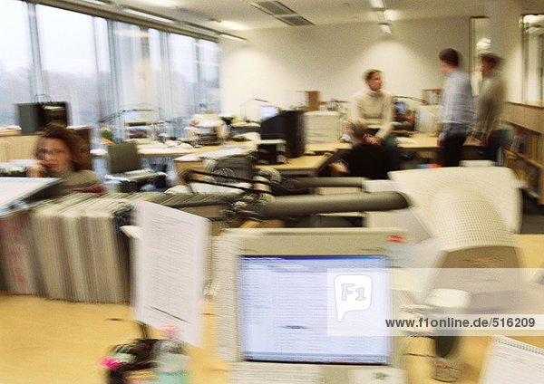 Business people working in office  blurred.