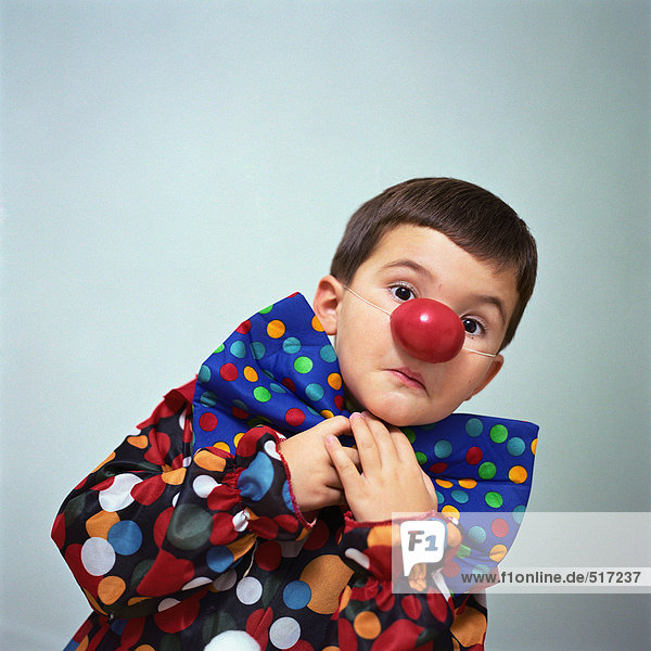 Boy dressed up as clown
