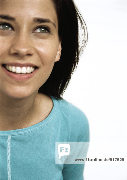 Woman smiling looking up  close up portrait