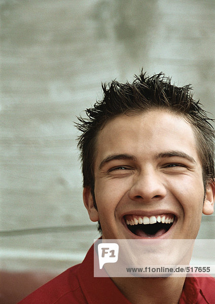Teenage boy laughing  portrait