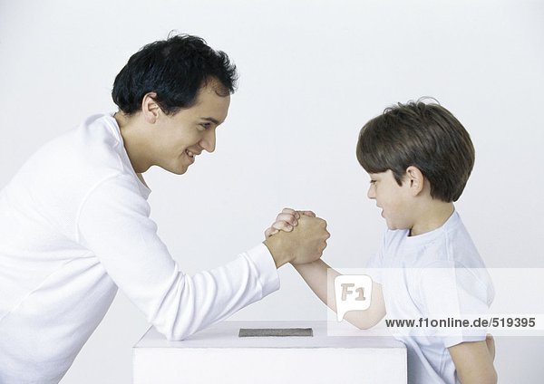 Father and son armwrestling