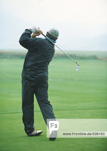 Golfer swinging