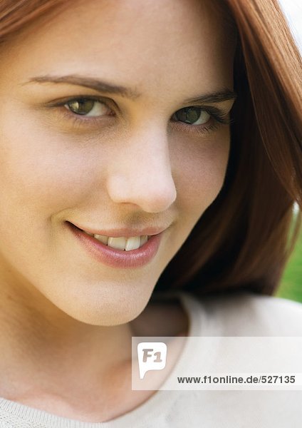 Young woman with sly smile  portrait