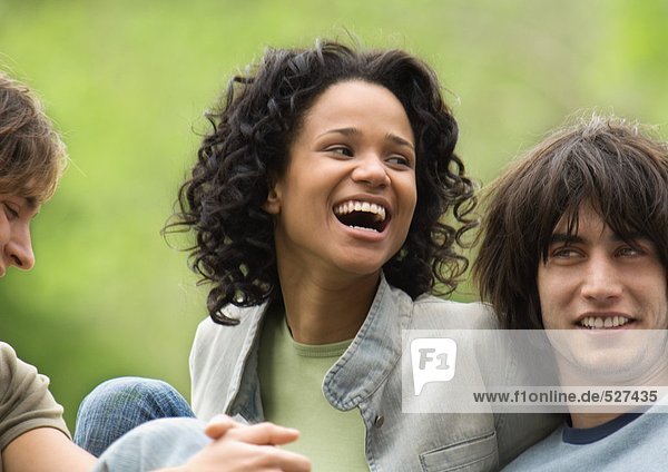 Group of friends  young woman laughing