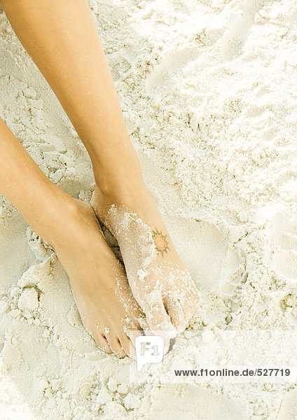 Woman's feet in sand