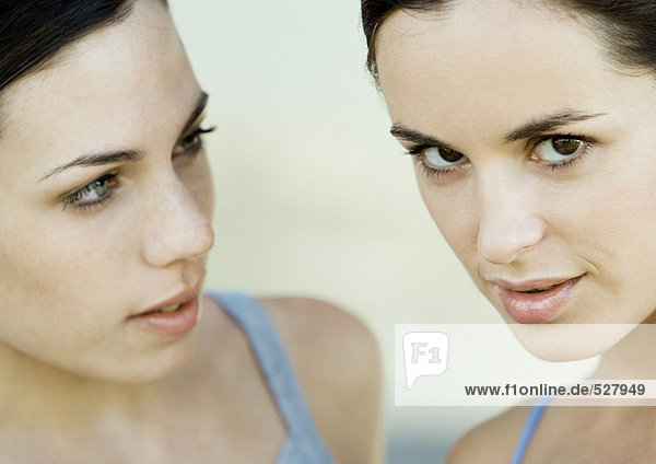 Young woman loooking at her friend