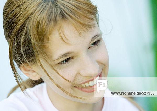 Girl smiling and looking away  portrait  close-up
