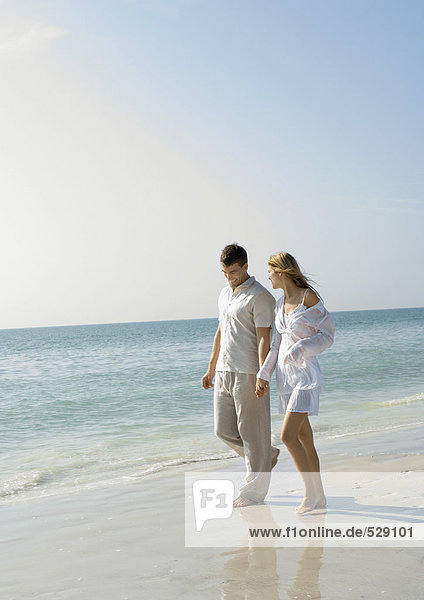 Couple walking on beach