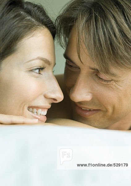 Couple smiling at each other  close-up