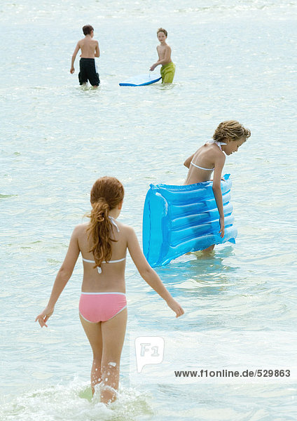 Children playing in water at the beach