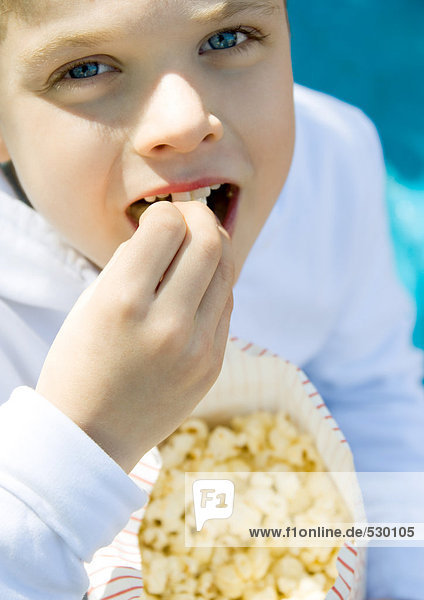Child eating popcorn