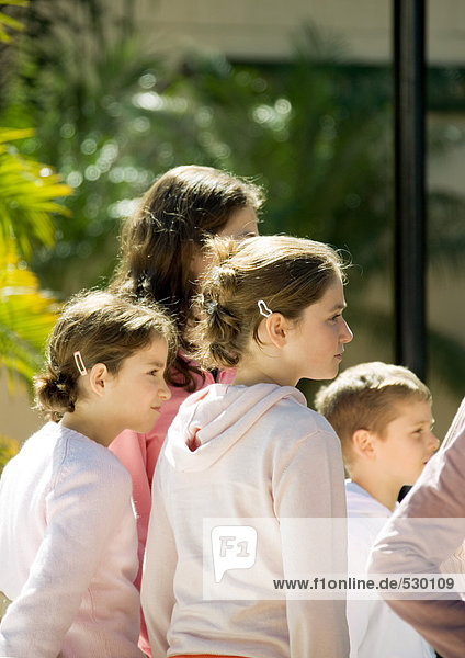 Group of children  looking in same direction
