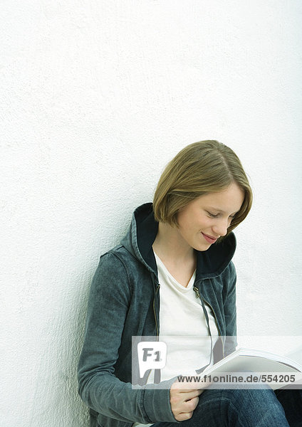 Teenage girl reading  portrait