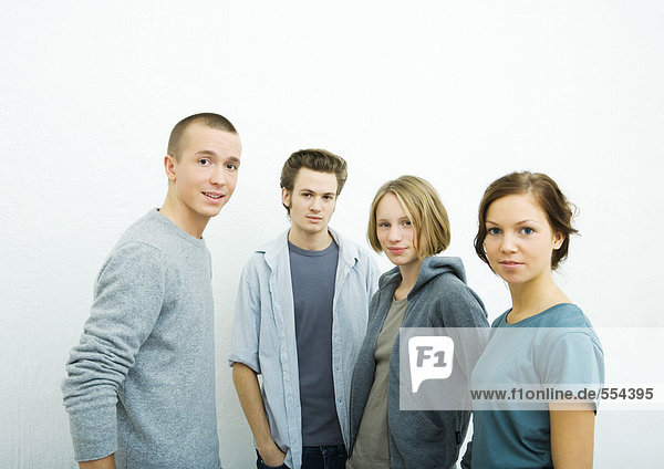Four young friends  looking at camera  portrait
