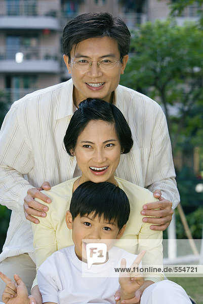 Family  smiling at camera  portrait