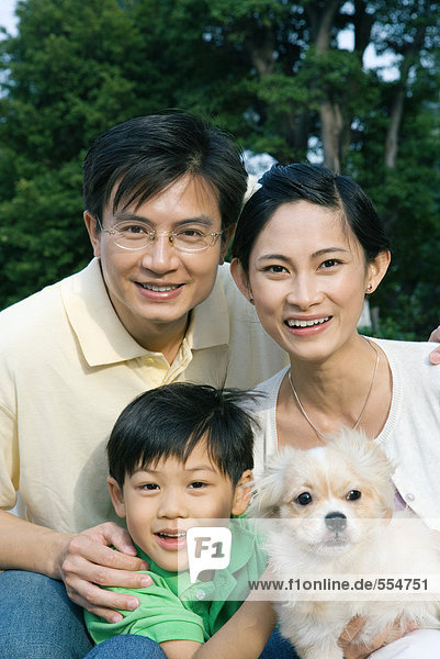 Boy with parents and pet dog  portrait