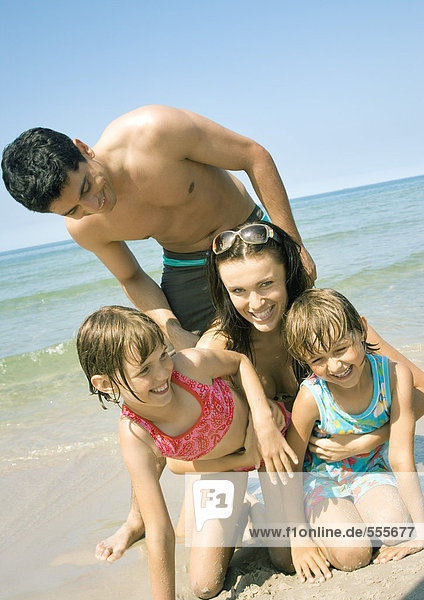 Family on beach  smiling