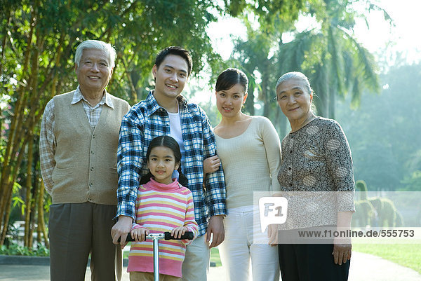 Three generation family in park  portrait