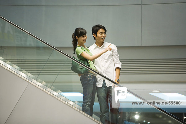 Couple on escalator