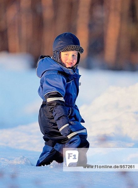 Little boy walking on snow. Västerbotten  Sweden