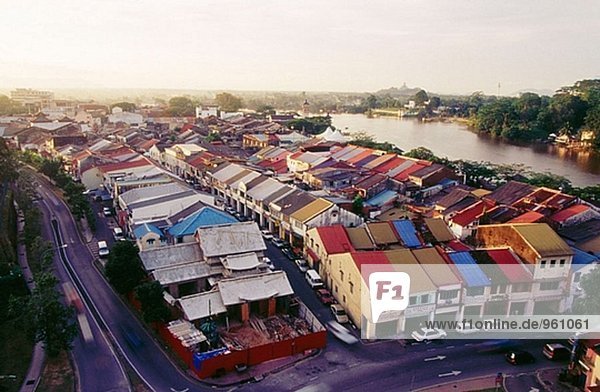 Aerial view of old shops in Kuching city with Sarawak River in background. Malaysia