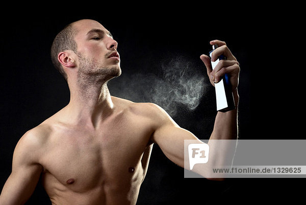 Man spraying fragrance
