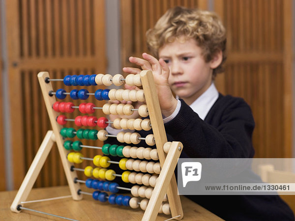 Boy using abacus