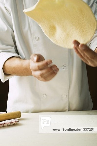 Shaping pizza dough (throwing it in the air)