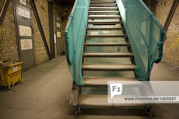 Empty stairs inside industrial building  London  England