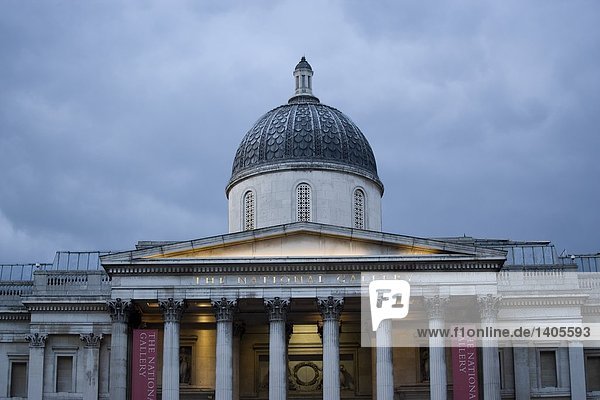 Low angle view of domed building against overcast sky  Trafalgar Square  Westminster  London  England