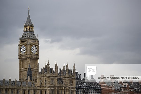 Clock tower and building against overcast sky  Westminster  Big Ben  London  England
