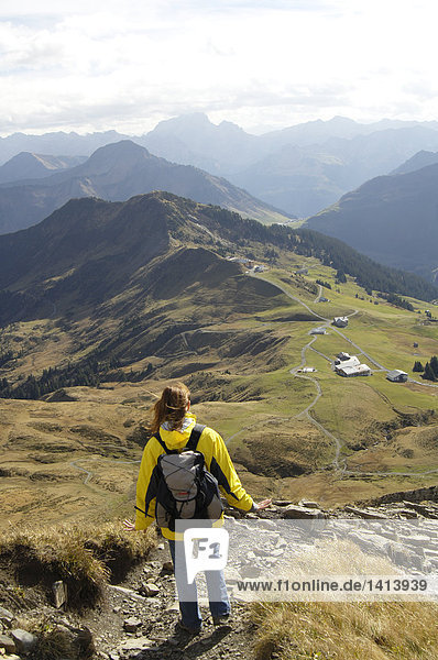 Woman with rucksack hiking  Bregenzer Wald  Austria  elevated view