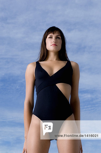 Young woman in black sexy swimming costume