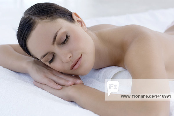 Young woman sleeping in bed  indoors
