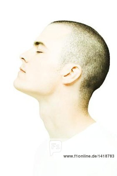Young man's head  eyes closed  profile
