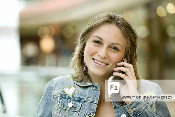Young woman using mobile phone  portrait