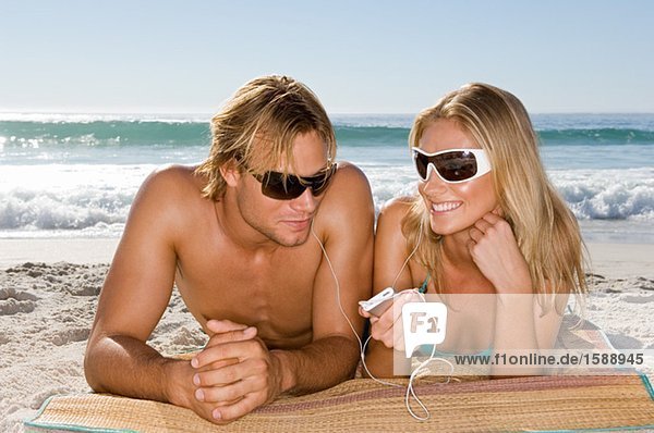 Couple listening to mp3 player