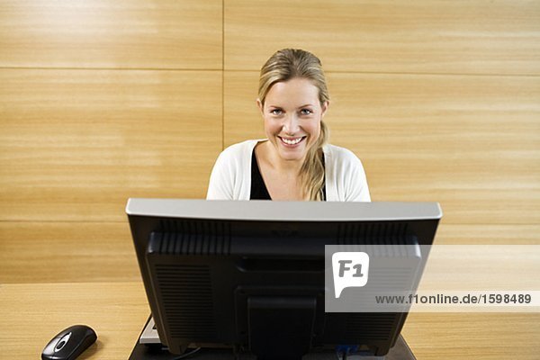 A woman working in an office.