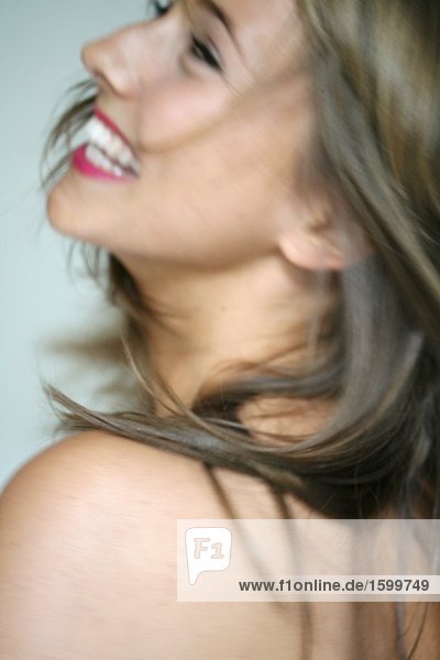 Close-up of young woman smiling