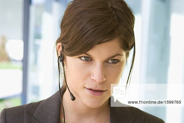 Close-up of businesswoman wearing headset
