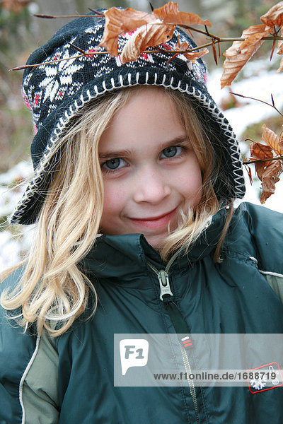 Girl with cap looking at camera  portrait
