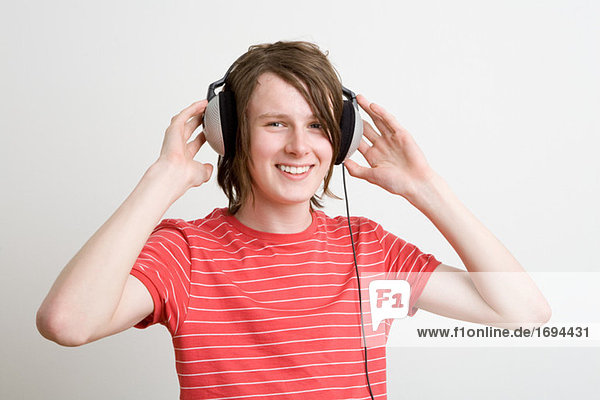 Teenage boy listening to music