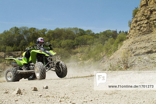 Man riding quad bike