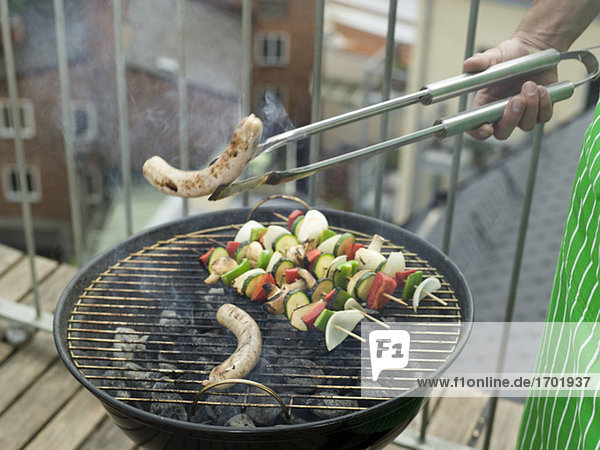 Barbecue grill with roast sausage