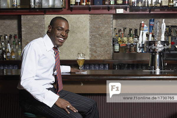 Businessman sitting at Bar