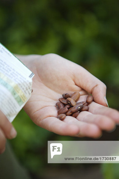 Woman holding seeds