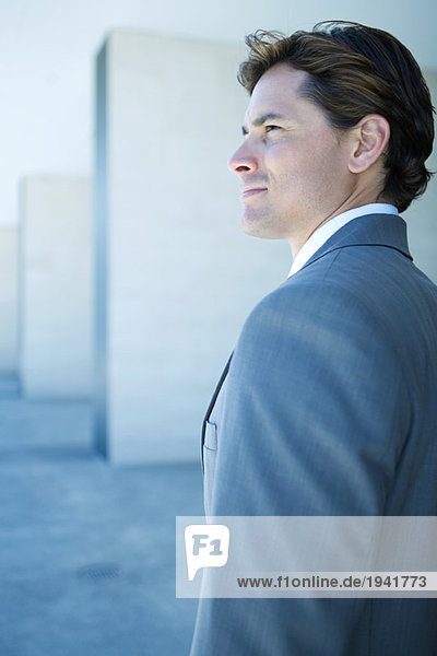 Young businessman looking away  profile  portrait